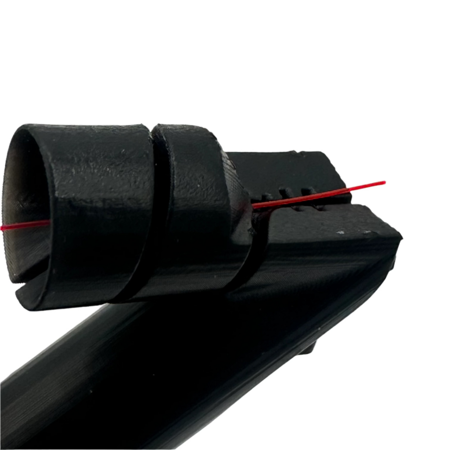 Black plastic component with a red line on a gray background