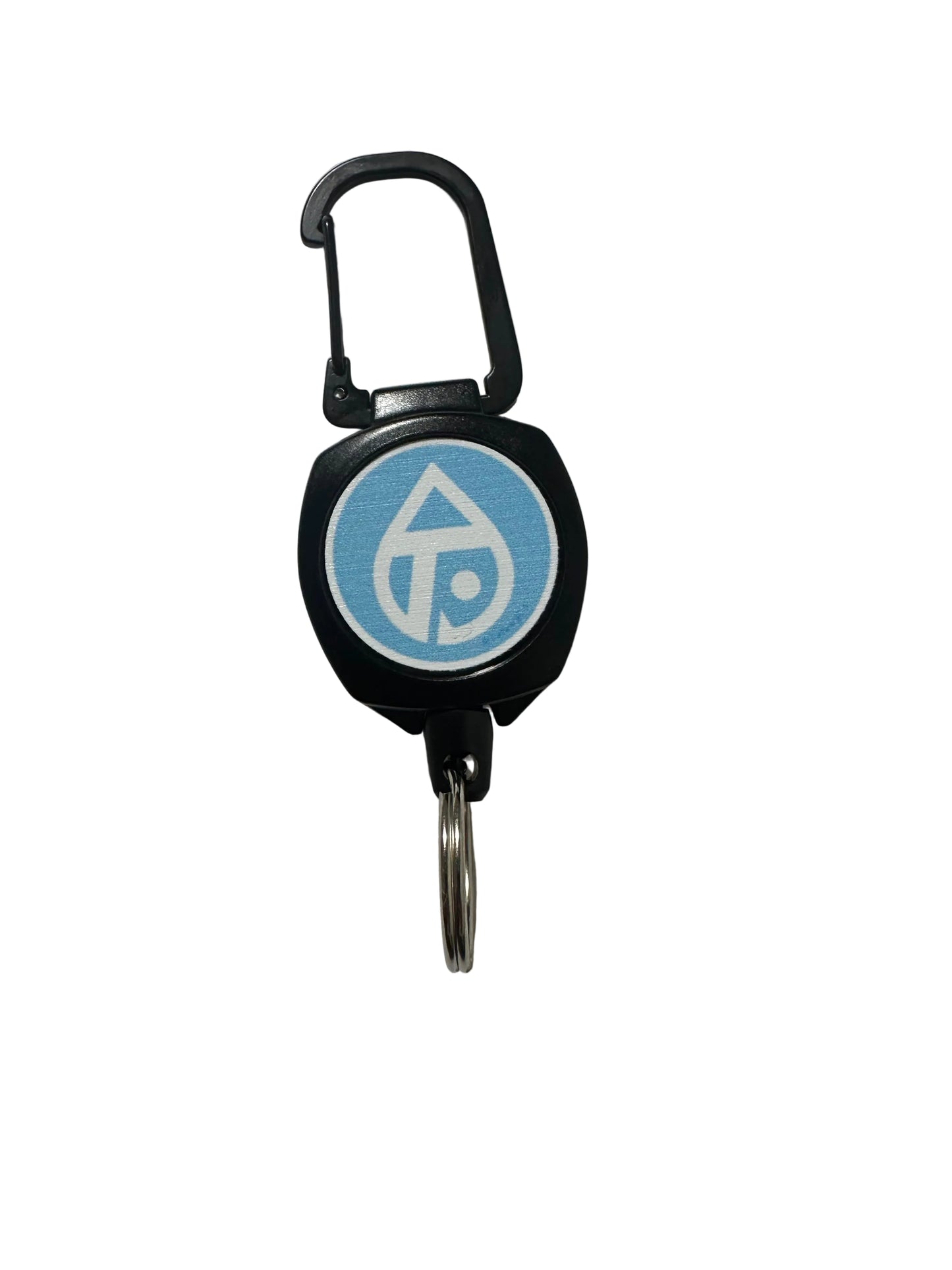 A black retractable fishing zinger with a blue and white circular logo on the face, attached to a silver metal key ring, photographed on a plain light gray surface.
