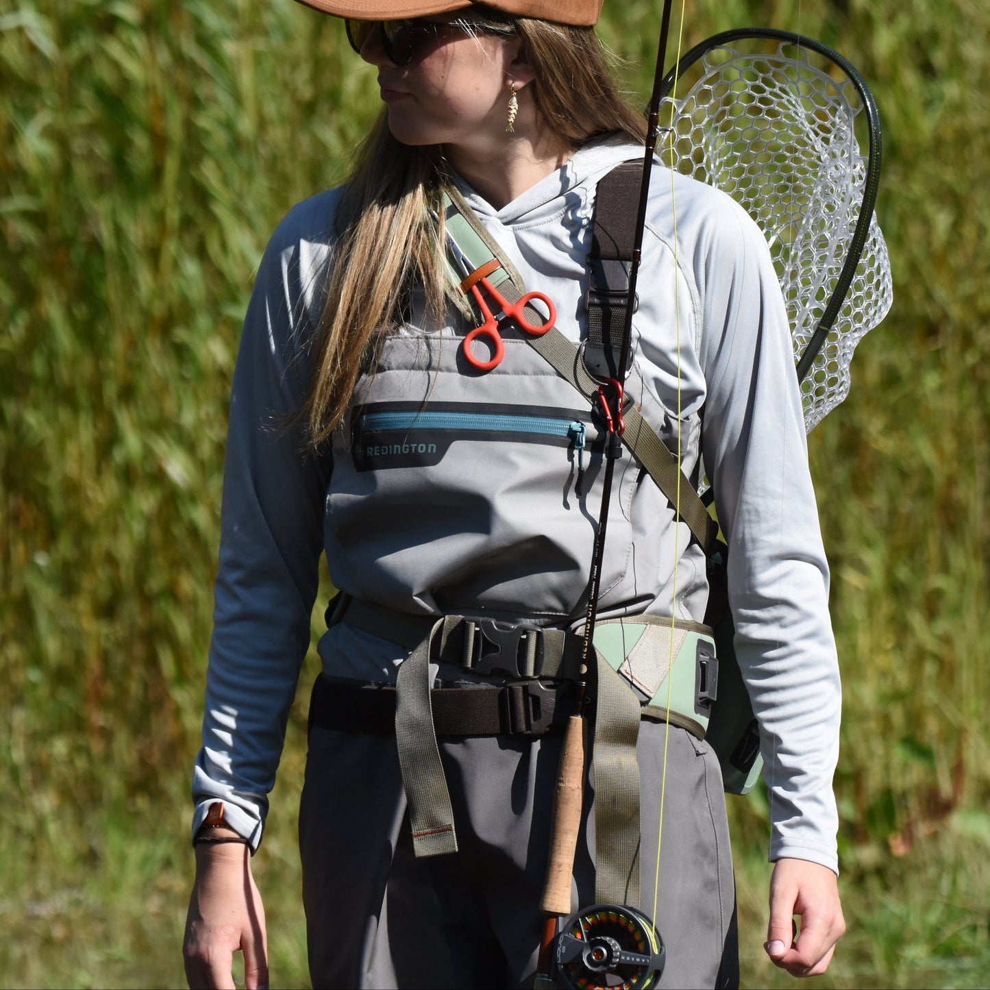 Angler using the Talweg Rod Roost magnetic rod holder